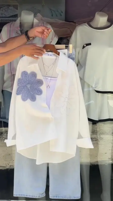 Chic Women’s Casual Outfit 🌸 | Elegant Peach Button-Down Shirt with Beaded Floral Embroidery ✨ & Relaxed-Fit Light Blue Jeans 👖 – Stylish Everyday Wear with Layered Necklace Accessory<
